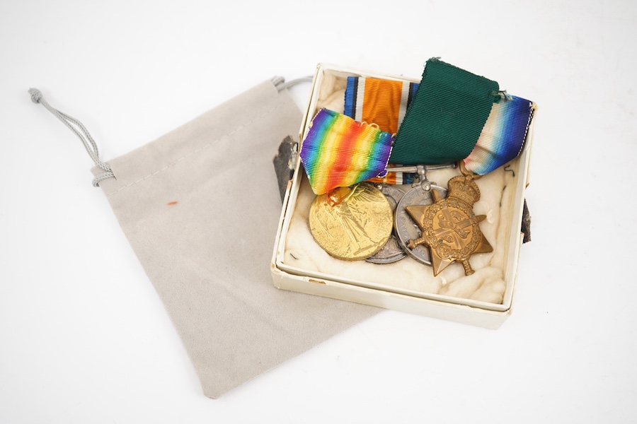 A First World War medal trio and Naval Reserve Long Service medal awarded to R.E.A. Lawrence ENGN RNR. Condition - fair.